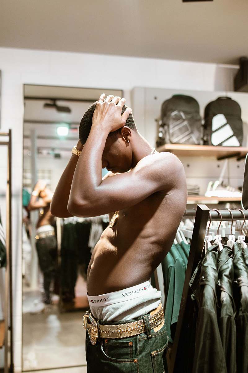 person standing man wearing gray denim bottoms apparel