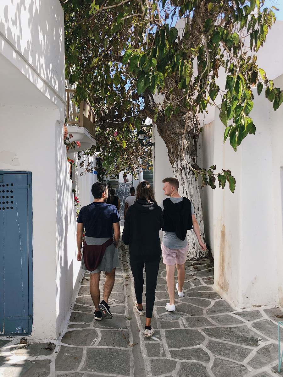 people three person walking in hallway person