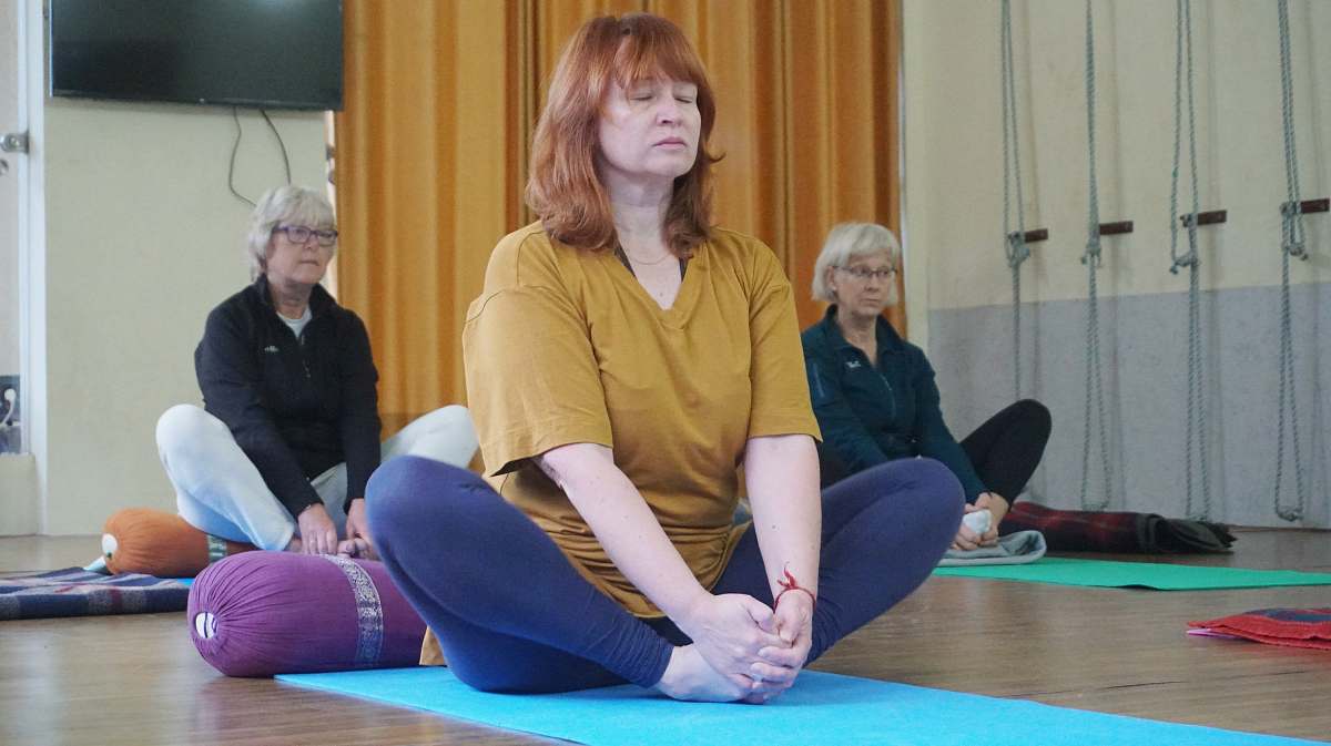 person three women sitting in lotus position sport