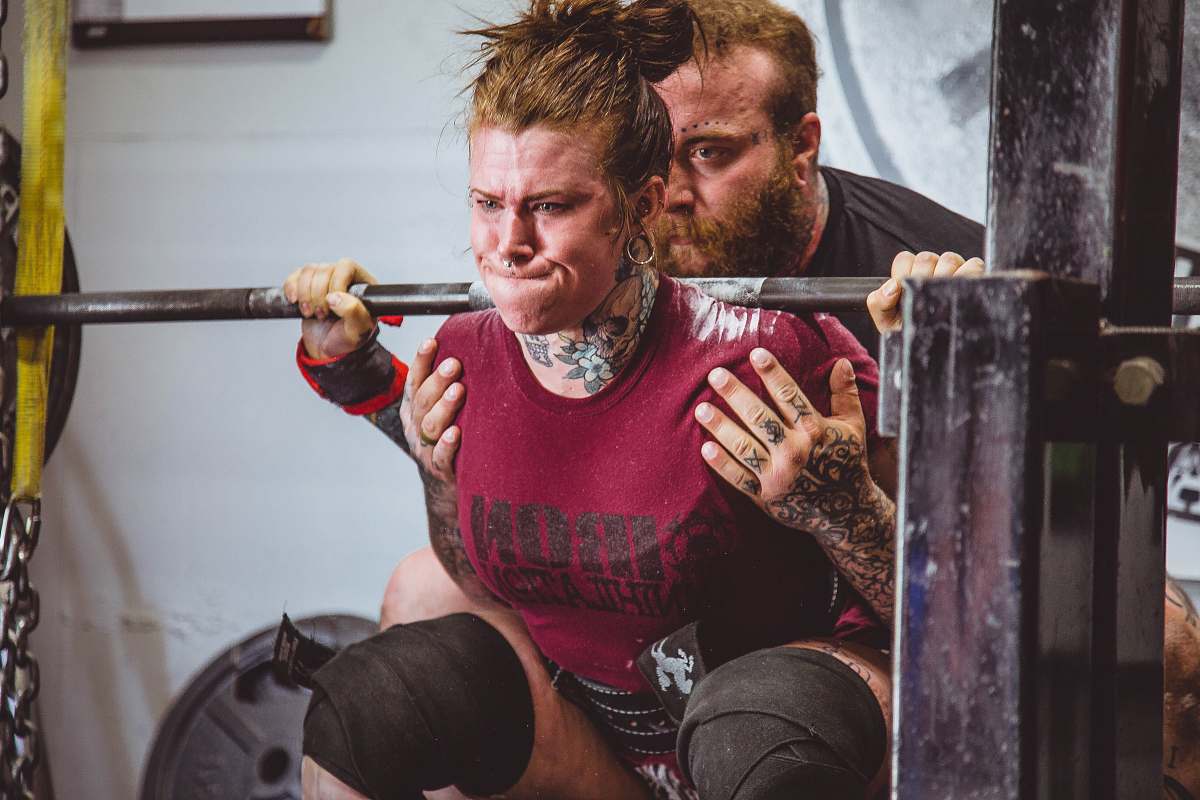 people woman carrying barbells person