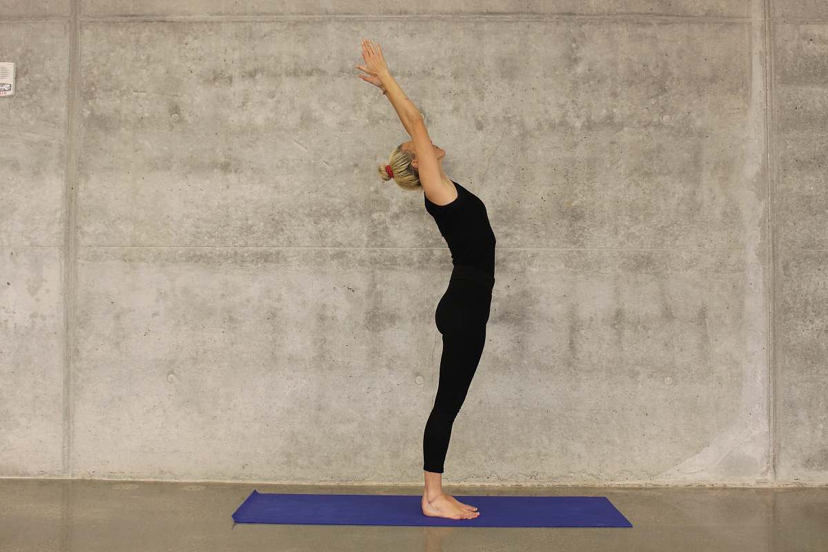 person woman doing yoga on yoga mat fitness