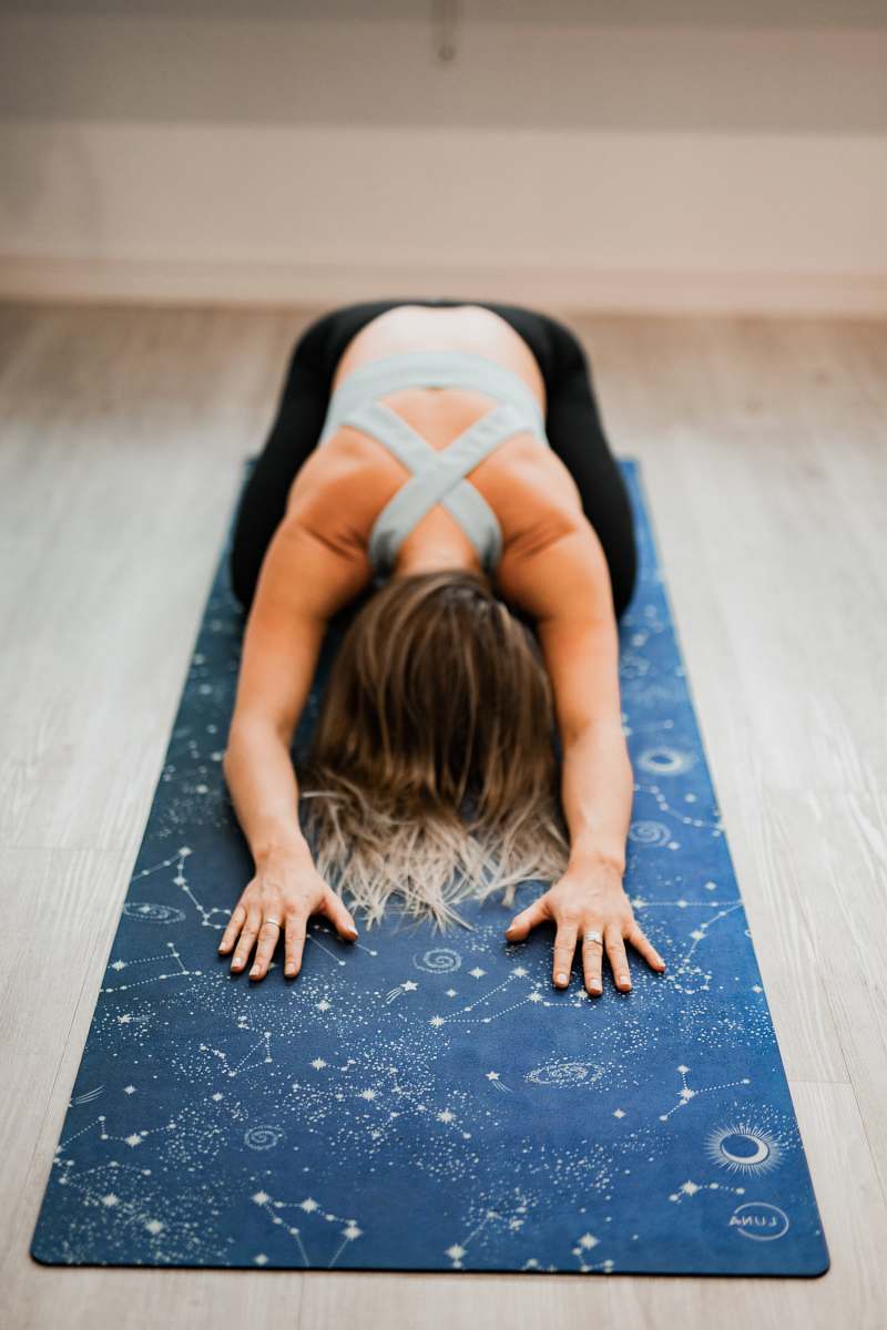 person woman doing yoga stretch