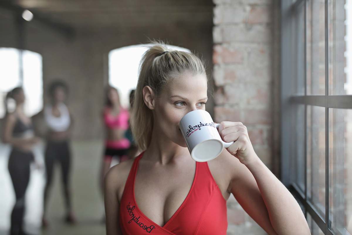 person woman drinking coffee people