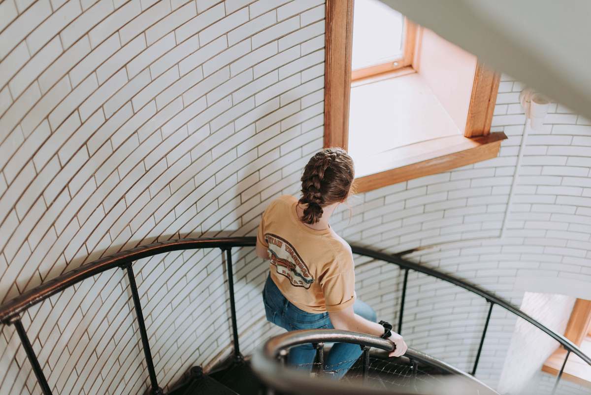 person woman going downstairs people