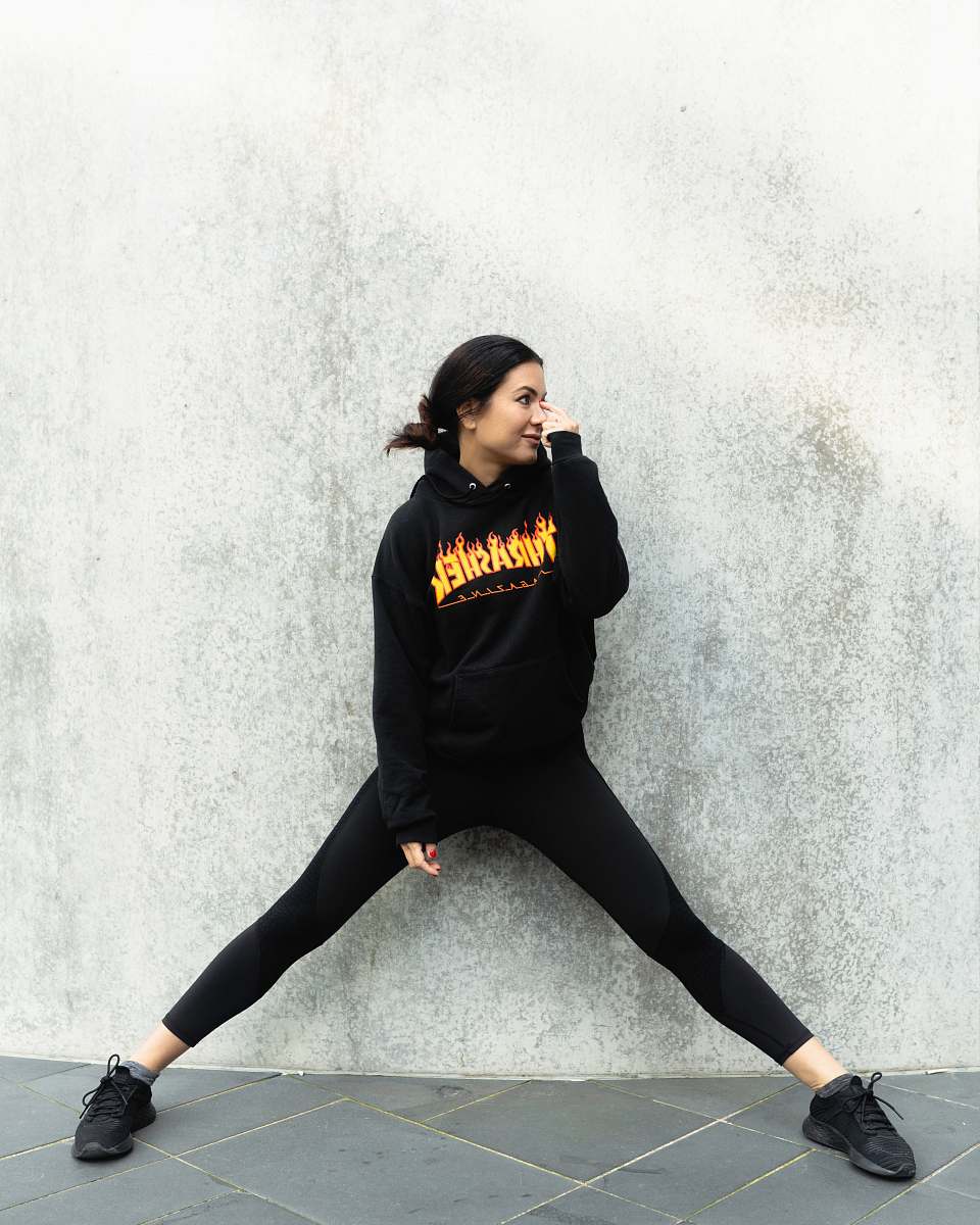 person woman leaning on wall clothing