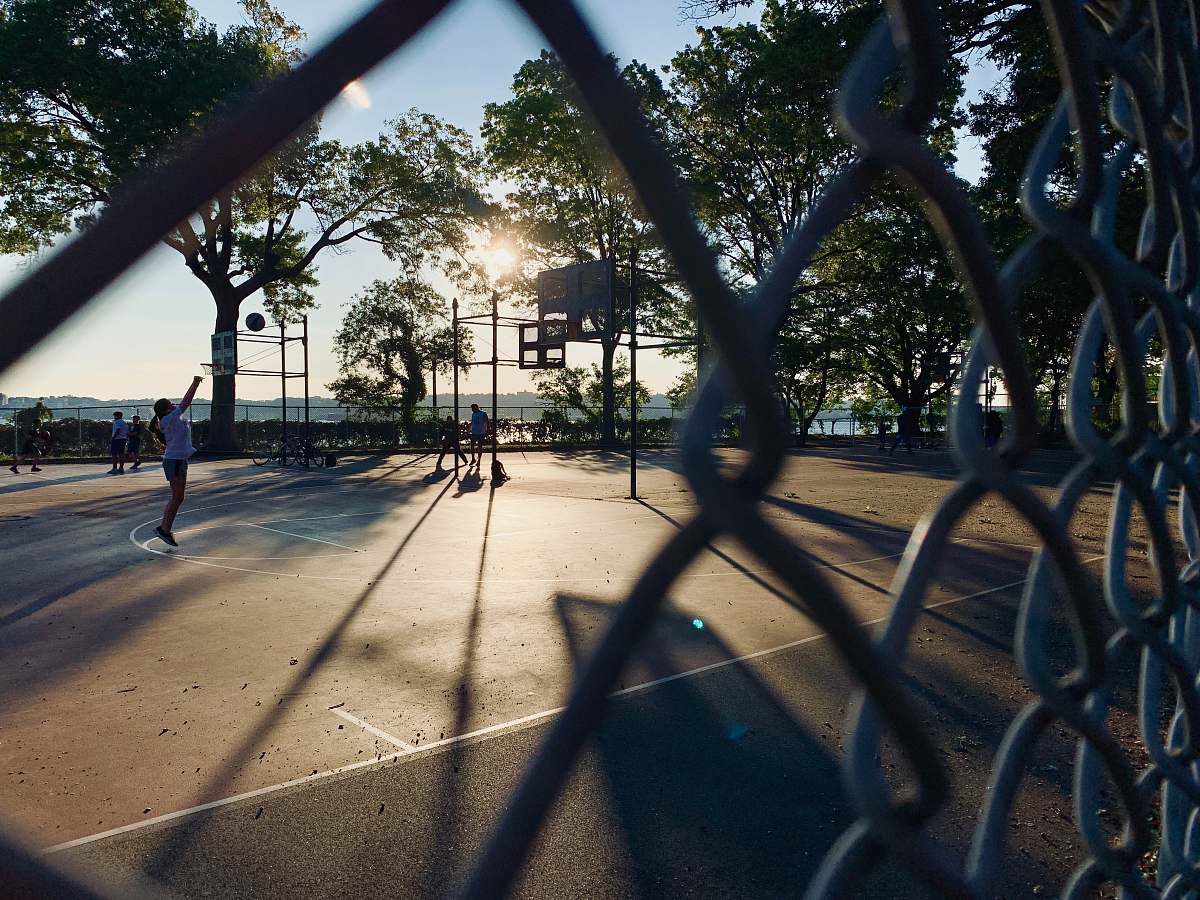 flare woman playing ball light