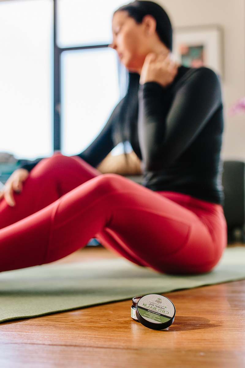 person woman sitting on yoga mat female