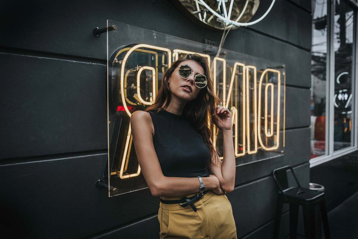 people woman standing in front of Diner neon signage person