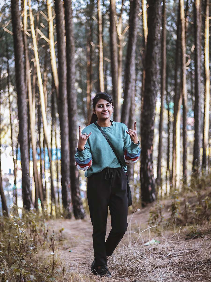 person woman standing near field of trees clothing