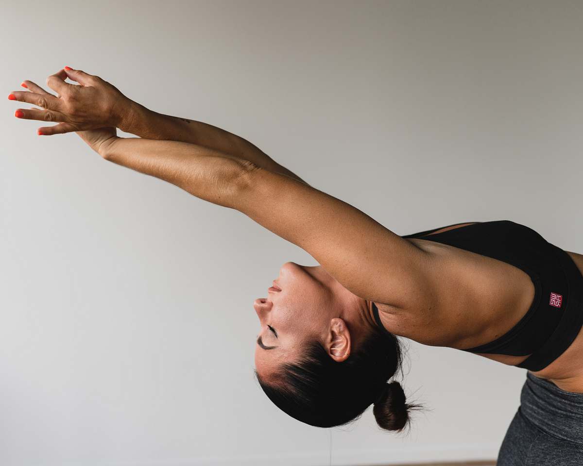 person woman stretching arms arm
