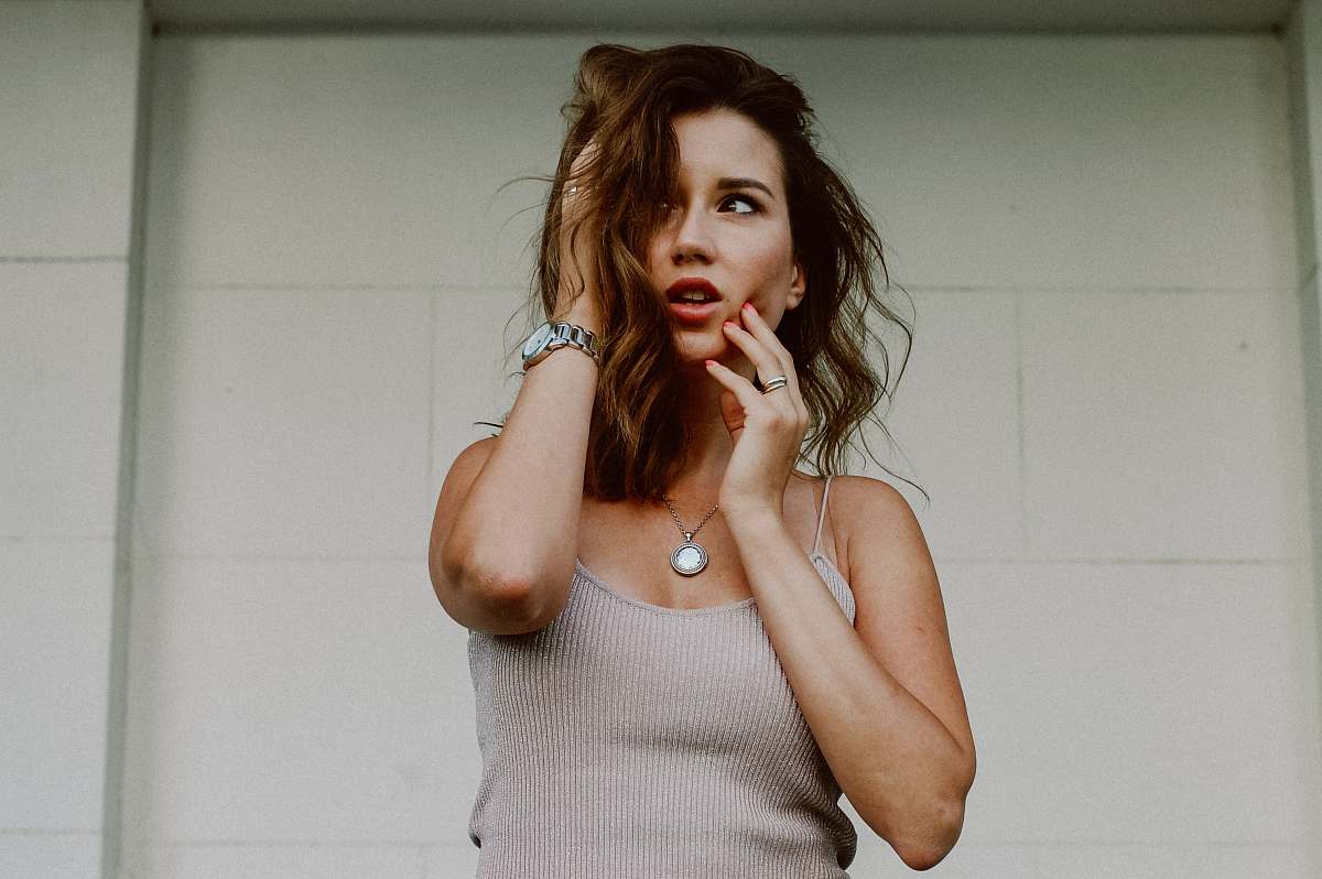 person woman touching her face people