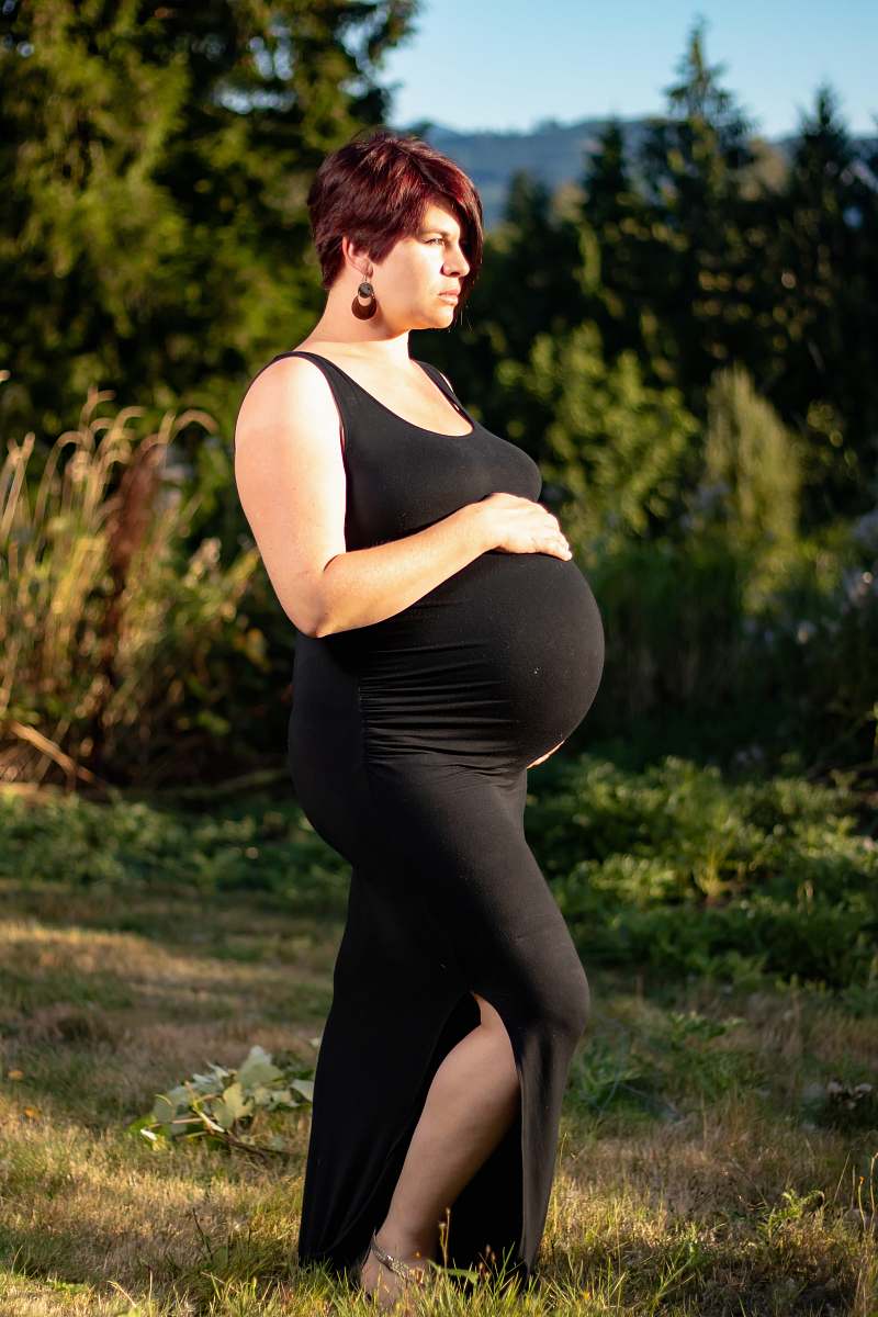 person woman wearing black sleeveless dress clothing