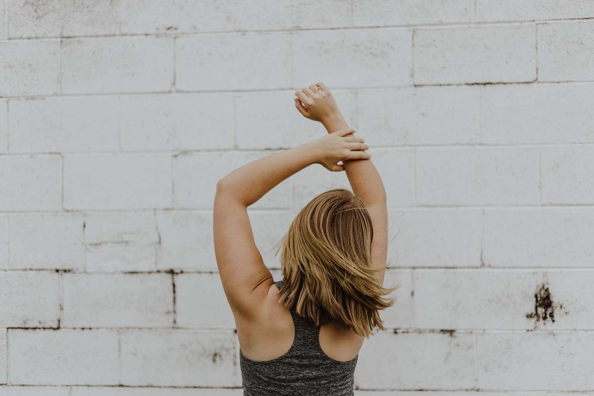 person woman wearing grey racerback top apparel