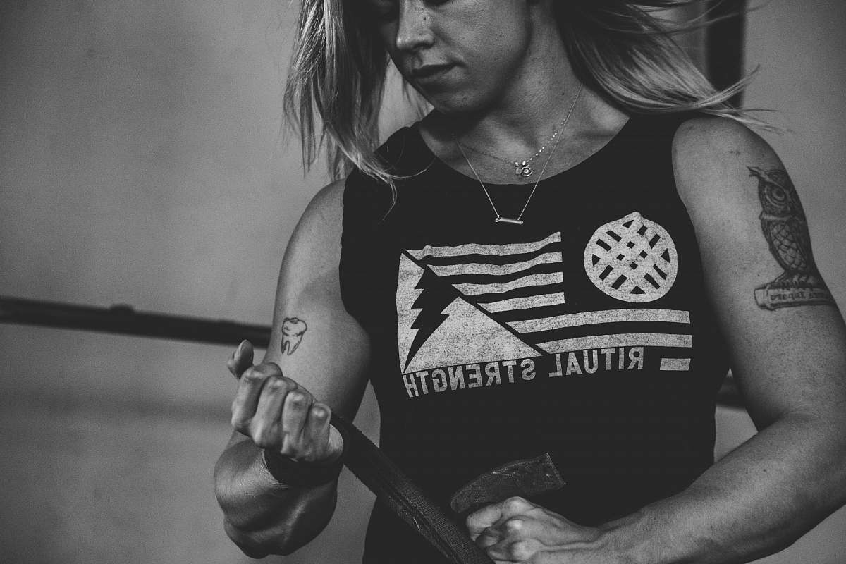 person woman wearing sleeveless top black-and-white