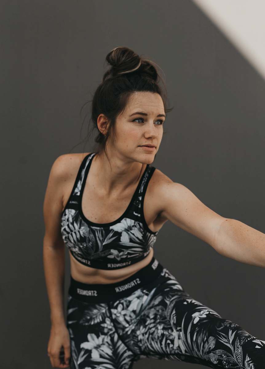 person woman wears fitness suit start to work out sports
