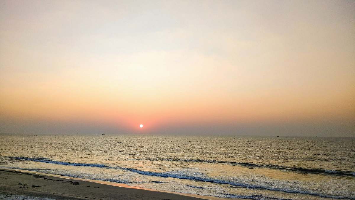 ocean body of water and sunrise outdoors