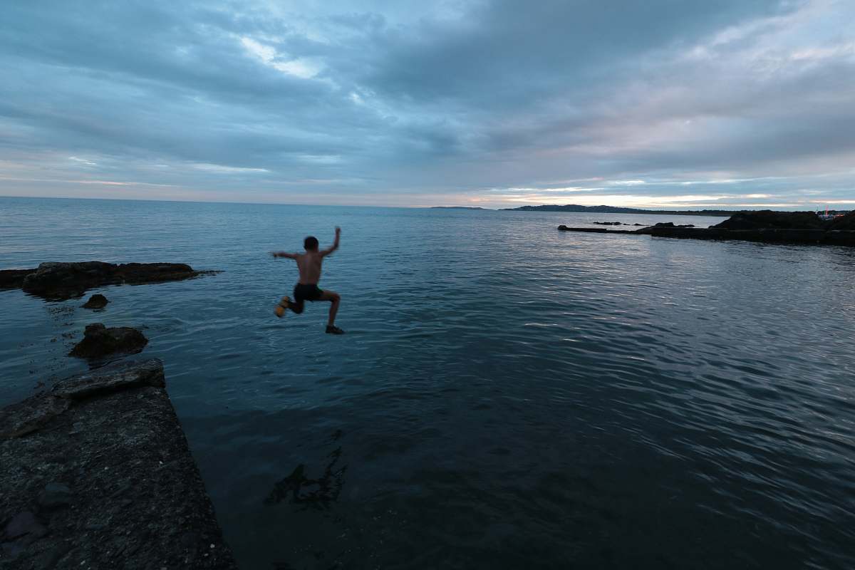 coast man about to jump ocean