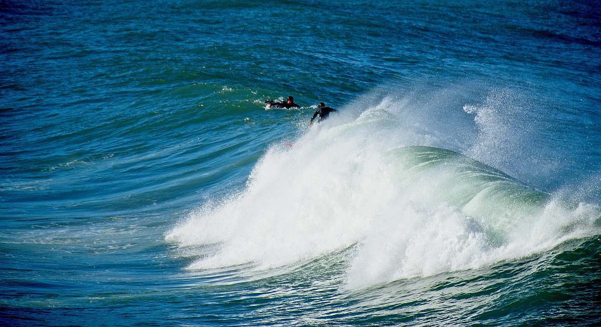 sea person surfing during daytime ocean