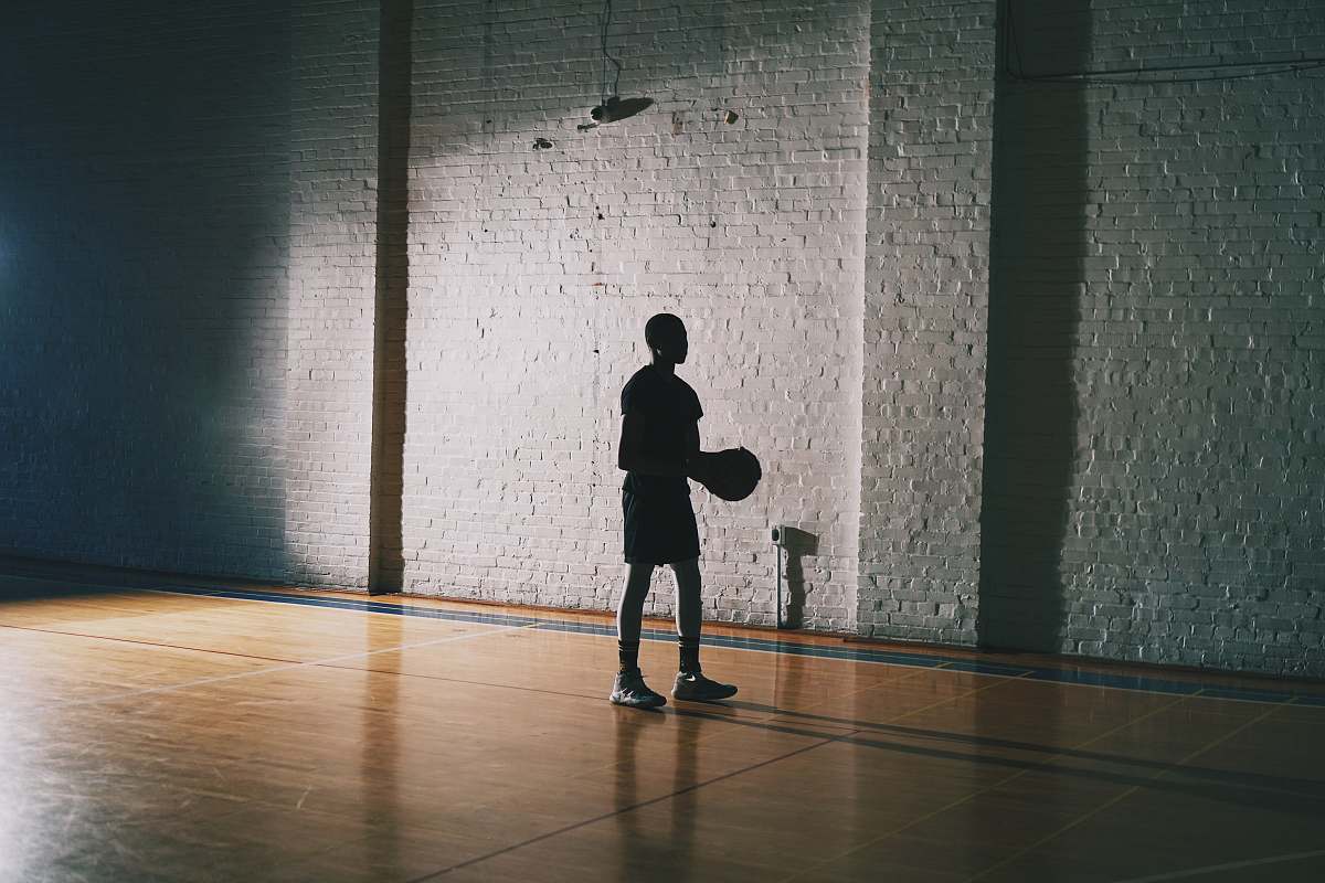 human man holding basketball person