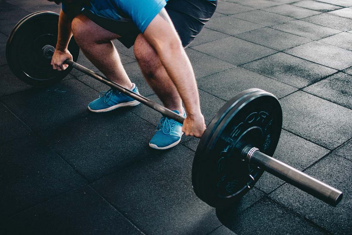 person person about to lift barbell human