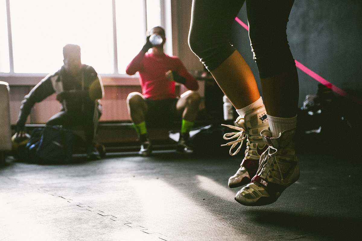 person person wearing brown-and-white shoes jumping human