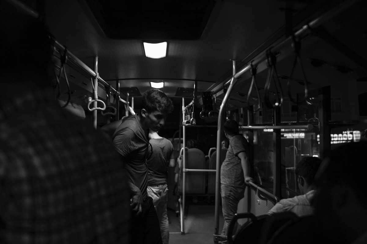 human grayscale photography of people inside train black-and-white