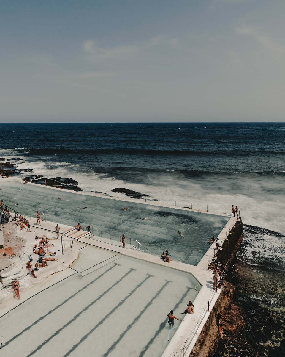 human group of people near pool water