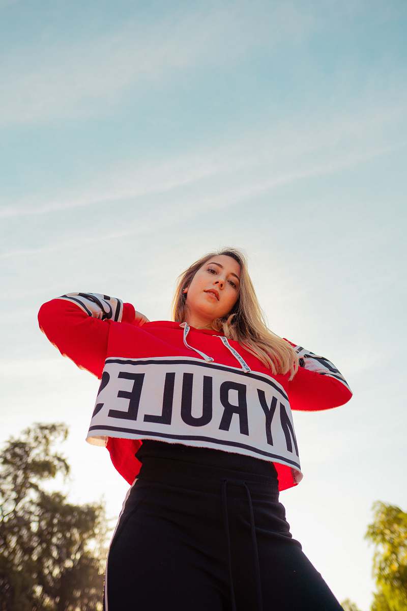 clothing low-angle photography of red and white My Rule jacket apparel