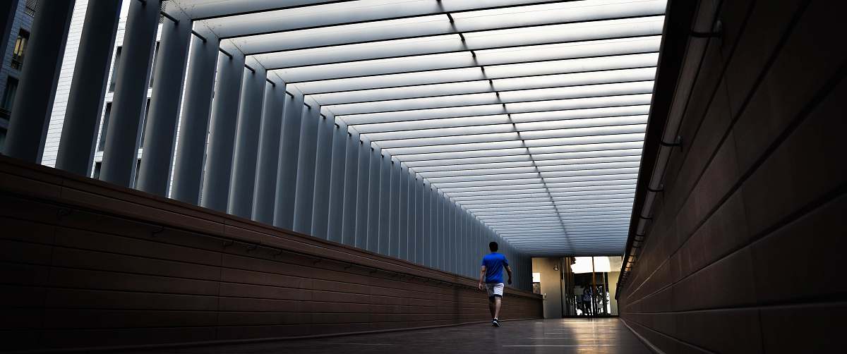 architecture man walking inside building dubai