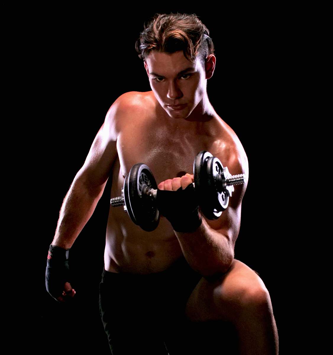 human man with black dumbbell close-up photography sport