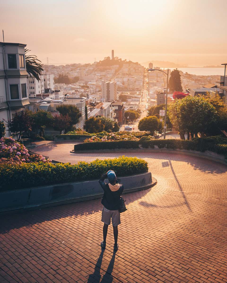 human person taking photo of building people