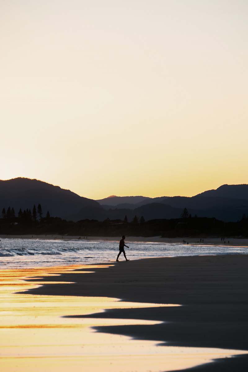 human person walking on seashore sea