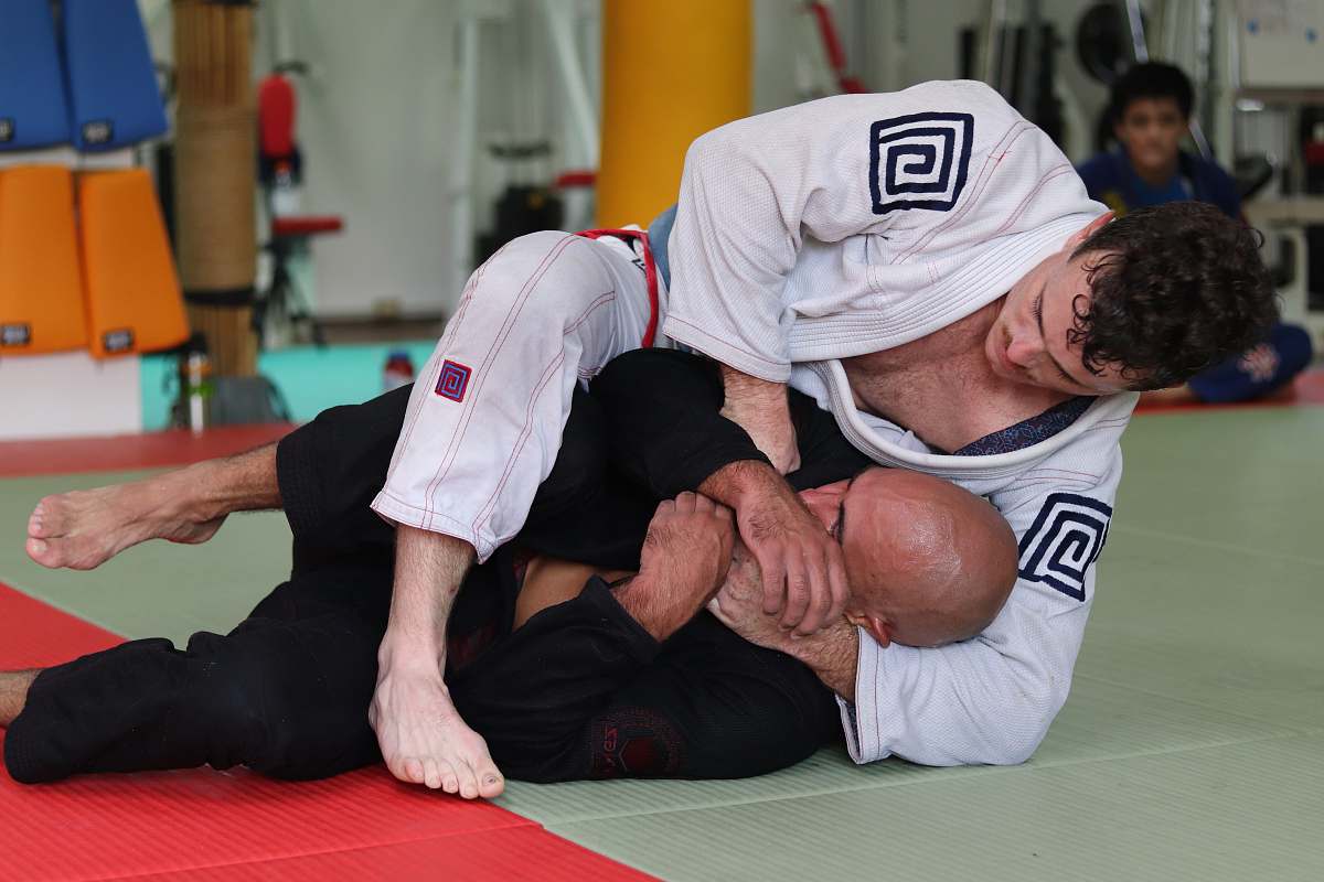 human two men doing jiu jutsu sport