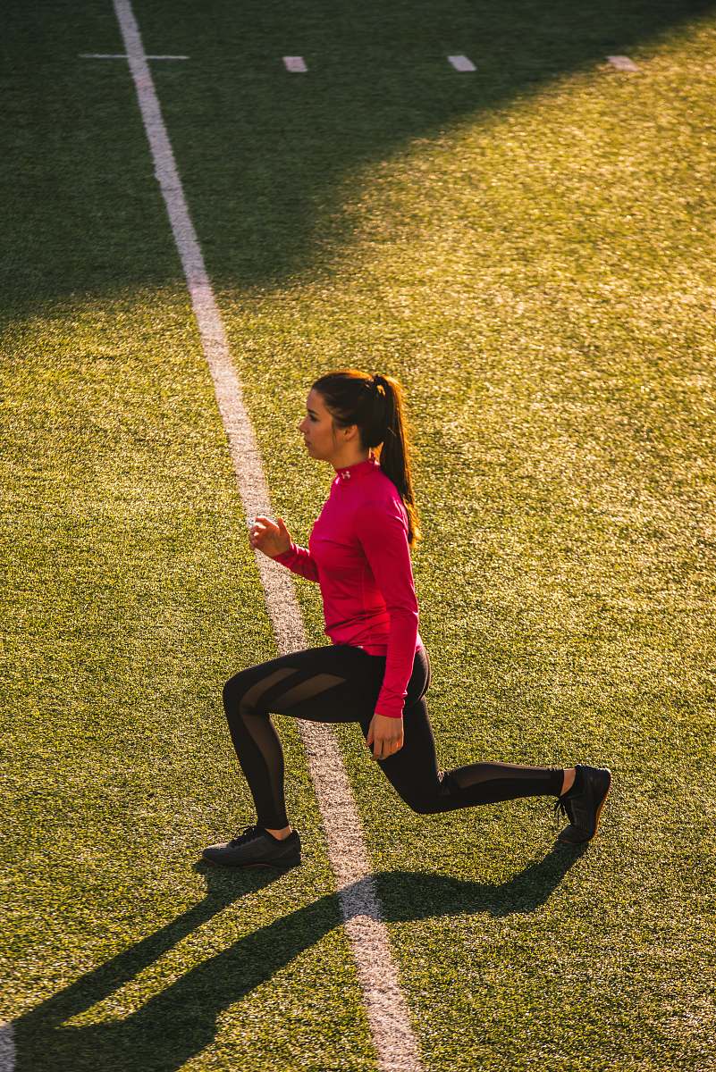 human woman bending on field sport