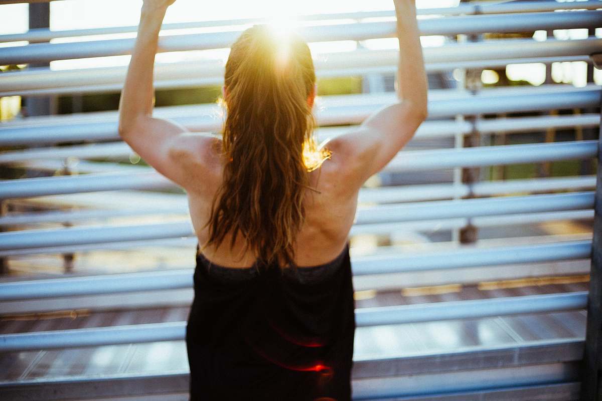 fitness woman doing pull up exercise people