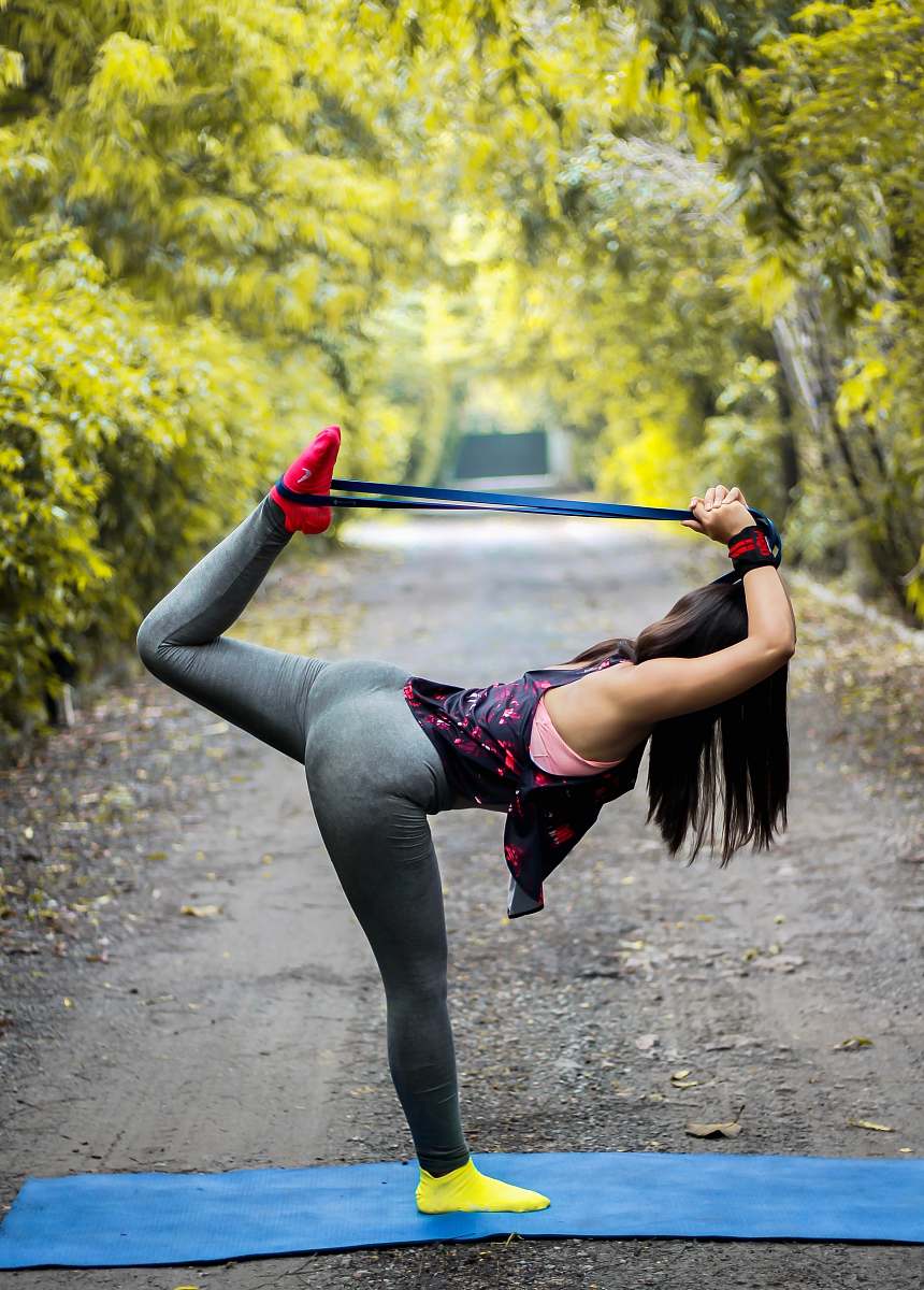 human woman doing yoga pose leisure activities