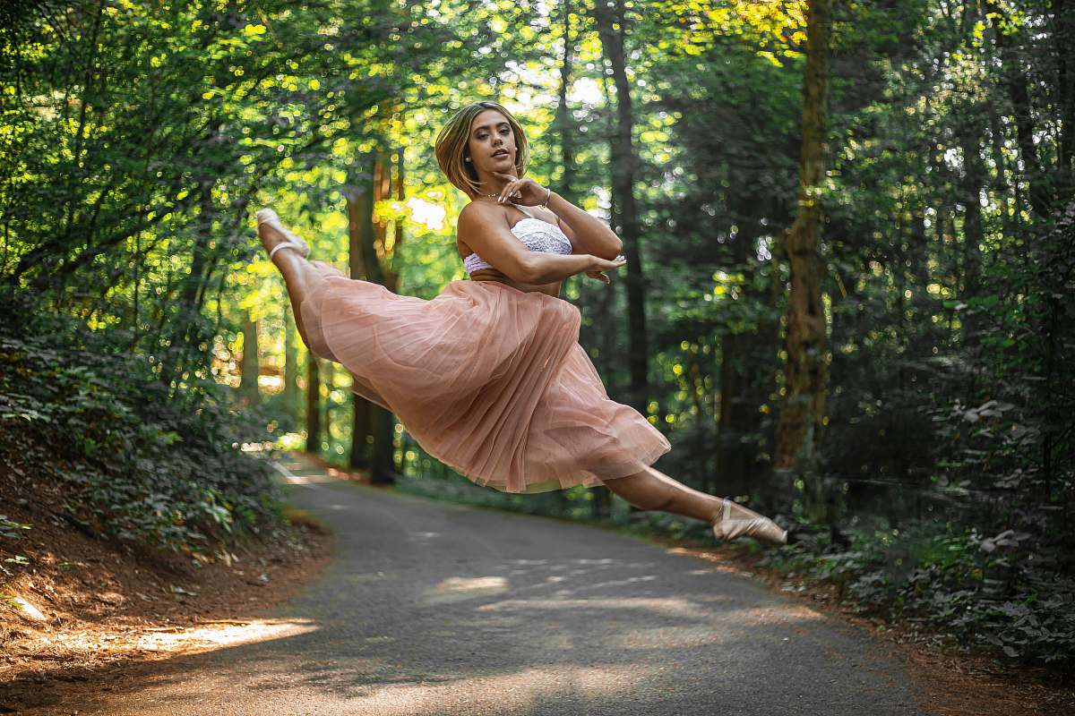 apparel woman jumping on road clothing