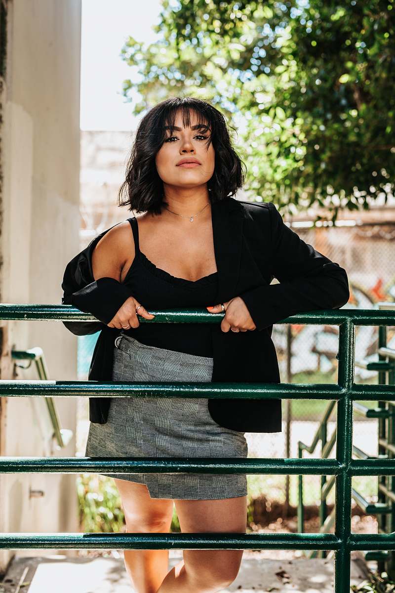 human woman leaning on fence people