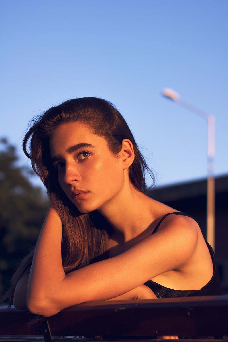 human woman near fence clothing