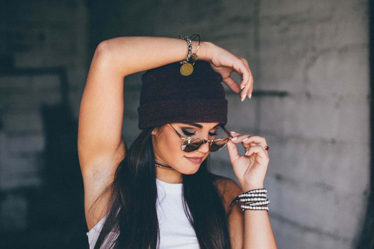 people woman put left hand on head fashion