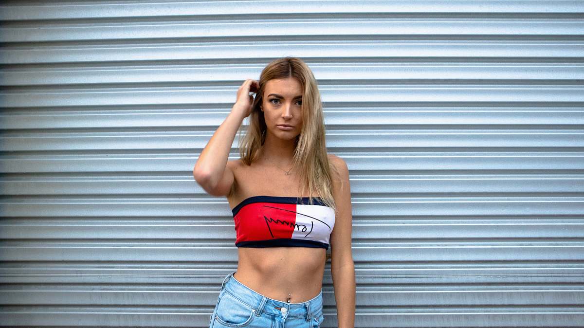 human woman standing in front of roll-up door people