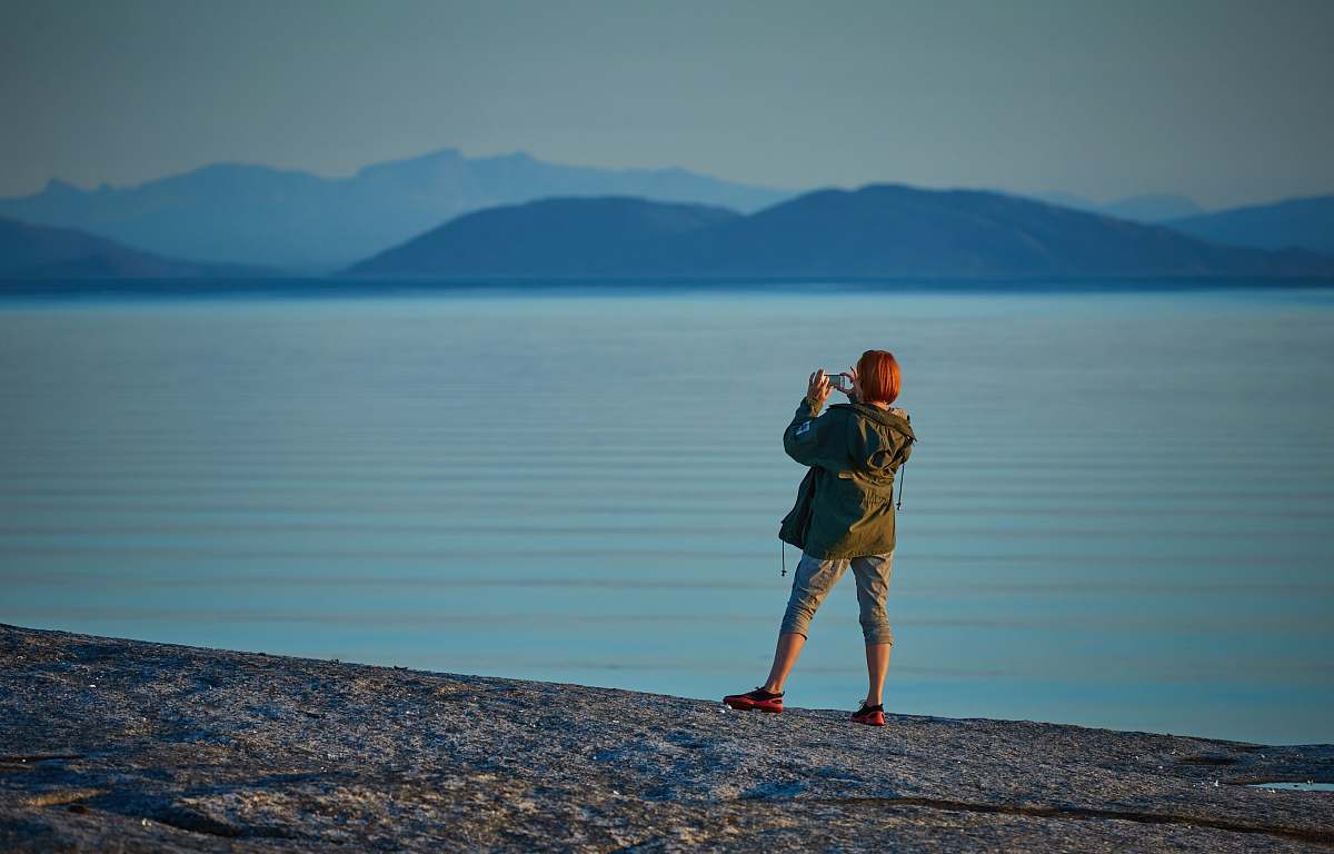 people woman standing near body of water human