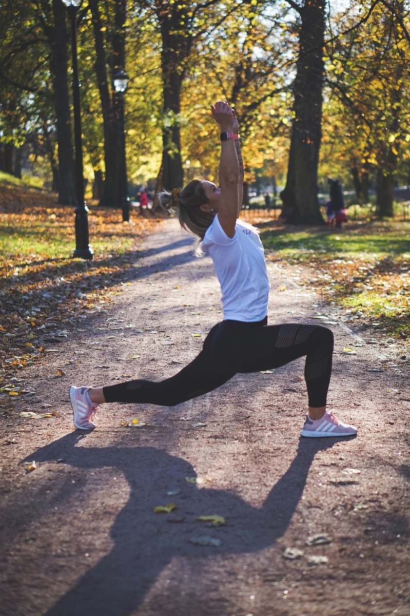 human woman stretching on pathway yoga