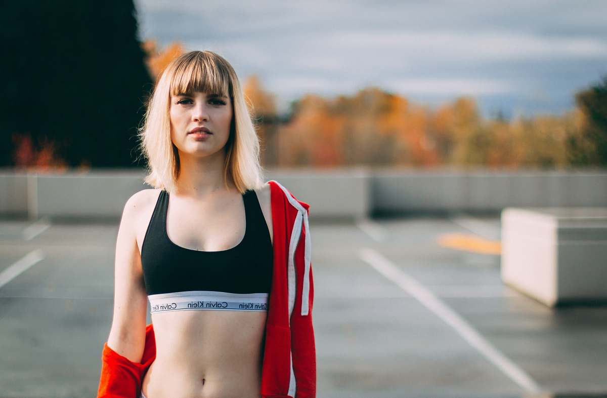 human woman wearing black sports brassiere people