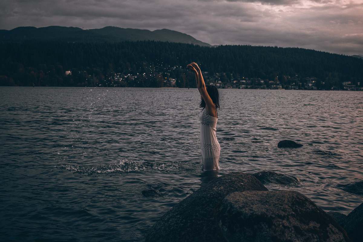 human woman wears white dress grey