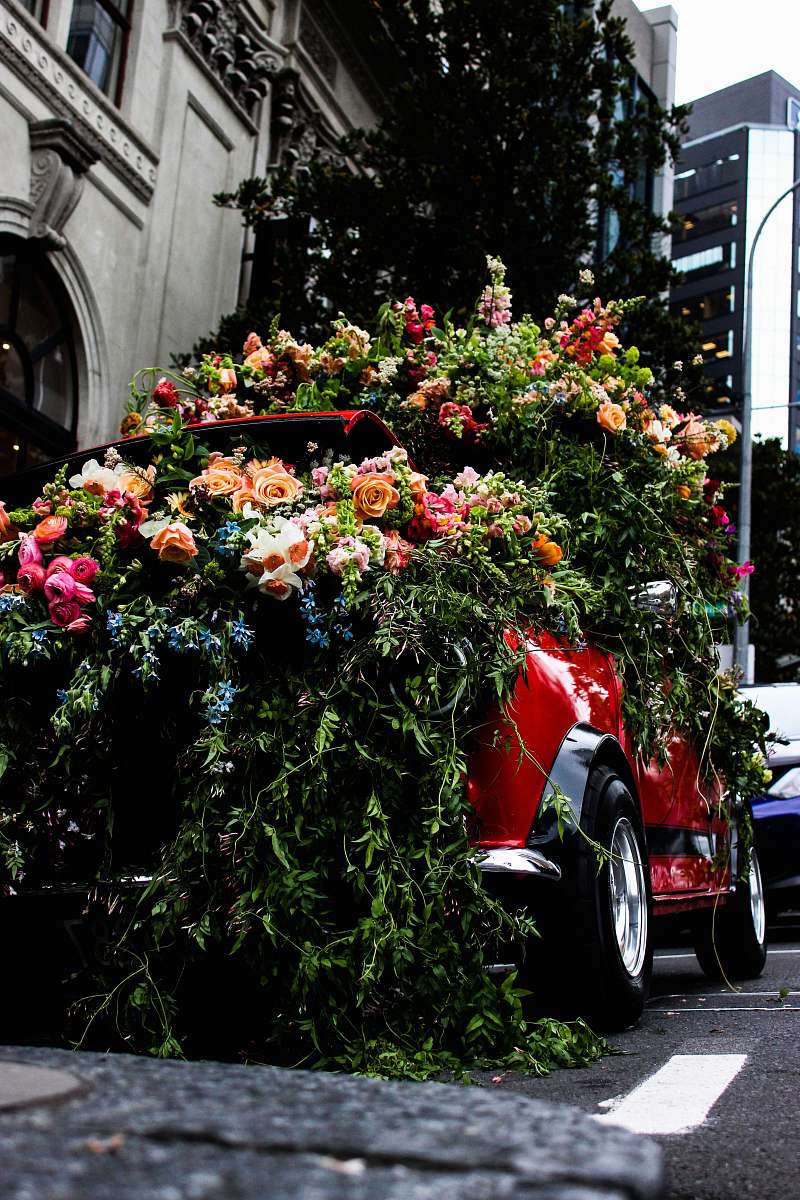 flower red vehicle covered with flowers blossom
