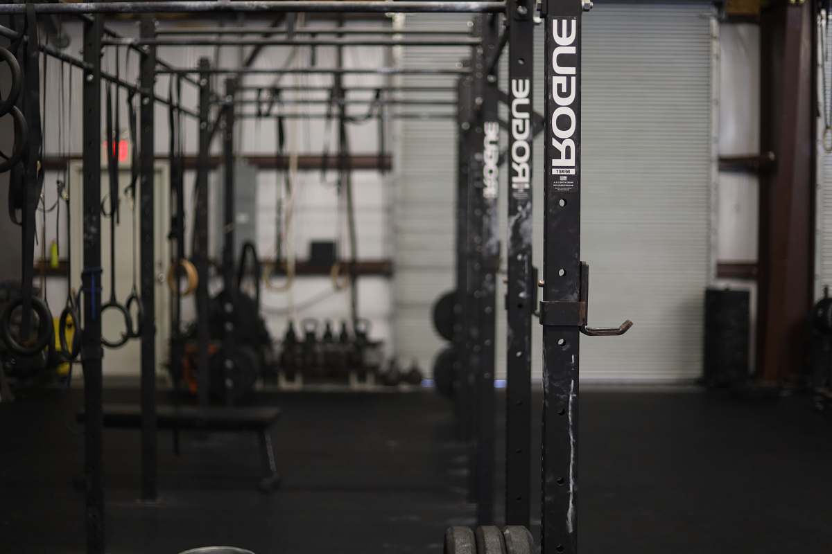 grey black exercise equipment working out