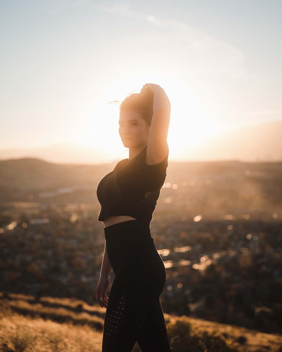 human woman holding hair during daytime person