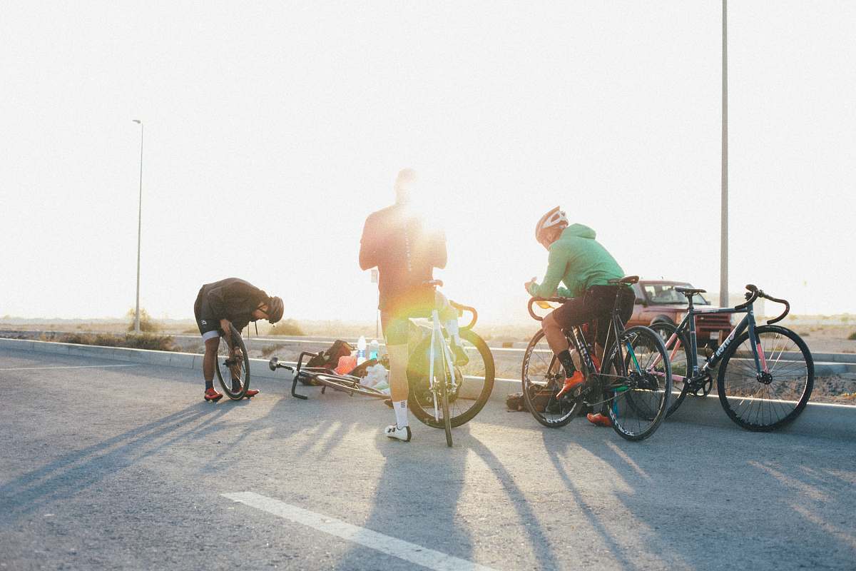 machine three road bike riders bicycle