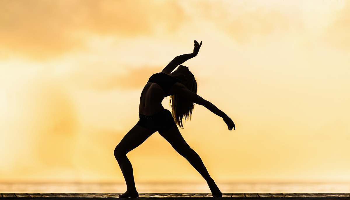 dance silhouette of woman making yoga pose leisure activities